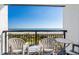 Relaxing balcony with ocean views, two chairs, and small table at 6804 Ocean Blvd. # 331, Myrtle Beach, SC 29572