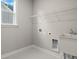 Functional laundry room with sink and storage at 700 Lapwind Loop, Myrtle Beach, SC 29579