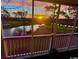 Stunning sunset view over the golf course and waterway from a screened porch at 703 Riverwalk Dr. # 301, Myrtle Beach, SC 29579