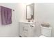 Clean bathroom with white vanity and a purple towel at 9000 Mabel Ct., Longs, SC 29568