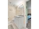 Clean bathroom with toilet, granite vanity, and white cabinets at 1101 Possum Trot Rd. # A103, North Myrtle Beach, SC 29582
