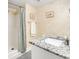 Bathroom with shower, granite vanity, and updated fixtures at 1101 Possum Trot Rd. # A103, North Myrtle Beach, SC 29582