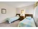 Bedroom with two twin beds and a view of the garden at 1101 Possum Trot Rd. # A103, North Myrtle Beach, SC 29582