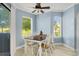 Bright dining area with table and four chairs, offering a view to the outside at 1101 Possum Trot Rd. # A103, North Myrtle Beach, SC 29582