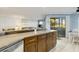 Island kitchen with granite countertops and wood cabinets at 1101 Possum Trot Rd. # A103, North Myrtle Beach, SC 29582