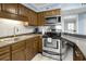 Well-equipped kitchen with stainless steel appliances at 1101 Possum Trot Rd. # A103, North Myrtle Beach, SC 29582
