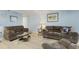 Living area with two sofas and a coffee table, creating a relaxing space at 1101 Possum Trot Rd. # A103, North Myrtle Beach, SC 29582