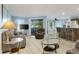 Bright living room with comfortable seating and wood-look floors at 1101 Possum Trot Rd. # A103, North Myrtle Beach, SC 29582