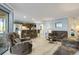 Open living room with comfortable seating and access to balcony at 1101 Possum Trot Rd. # A103, North Myrtle Beach, SC 29582