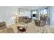 Living room with comfortable seating and a view to the balcony at 1101 Possum Trot Rd. # A103, North Myrtle Beach, SC 29582
