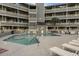 Community pool with lounge chairs and surrounding patio at 1101 Possum Trot Rd. # A103, North Myrtle Beach, SC 29582