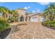 Grand two-story home with a large driveway and lush landscaping at 1501 Serena Dr., Myrtle Beach, SC 29579