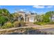 Grand home exterior with a large driveway and lush landscaping at 1501 Serena Dr., Myrtle Beach, SC 29579