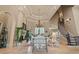 Two-story living room with a fireplace, staircase, and ample natural light at 1501 Serena Dr., Myrtle Beach, SC 29579