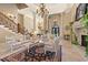 Living room with a grand staircase, high ceilings, and comfortable seating at 1501 Serena Dr., Myrtle Beach, SC 29579