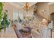 Living room with a curved staircase and comfortable seating area at 1501 Serena Dr., Myrtle Beach, SC 29579