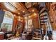 Spacious home office with spiral staircase and built-in shelving at 1501 Serena Dr., Myrtle Beach, SC 29579