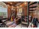 Home office with wood paneling, spiral staircase, and leather seating at 1501 Serena Dr., Myrtle Beach, SC 29579