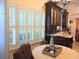 Kitchen with white shutters, granite counters and dark cabinets at 1605 Wood Thrush Dr., Murrells Inlet, SC 29576