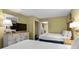 Bright bedroom with two double beds and views into the living area at 2311 S Ocean Blvd. # 967, Myrtle Beach, SC 29577