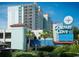 Compass Cove Oceanfront Resort: Attractive beachfront high-rise building with palm trees at 2311 S Ocean Blvd. # 967, Myrtle Beach, SC 29577