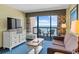 Living room with ocean views, comfortable seating and dining area at 2311 S Ocean Blvd. # 967, Myrtle Beach, SC 29577