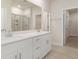 Bathroom boasts double vanity, large mirror, and walk-in shower at 3087 Dover Branch Dr., Little River, SC 29566