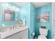 Bathroom with vanity, toilet, and beach-themed decor at 6100 N Ocean Blvd. # 207, North Myrtle Beach, SC 29582