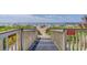 Private walkway to beach with caution signs at 6100 N Ocean Blvd. # 207, North Myrtle Beach, SC 29582