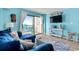 Living room with blue couch and ocean view at 6100 N Ocean Blvd. # 207, North Myrtle Beach, SC 29582