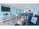 Living area with blue couch and ocean view at 6100 N Ocean Blvd. # 207, North Myrtle Beach, SC 29582
