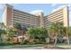 Oceanfront building with palm trees and ample parking at 6900 N Ocean Blvd. # 841, Myrtle Beach, SC 29572