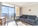 Living room with ocean view and sliding doors to balcony at 6900 N Ocean Blvd. # 841, Myrtle Beach, SC 29572