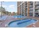 Resort-style pool area with a separate kiddie pool and lounge chairs at 6900 N Ocean Blvd. # 841, Myrtle Beach, SC 29572
