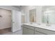 Modern bathroom with double vanity, walk in shower, and large closet at 724 Wallace Dr., Little River, SC 29566