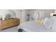 Bright bedroom with large windows, a dresser, and a comfortable bed at 724 Wallace Dr., Little River, SC 29566