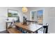 Farmhouse style dining area with wooden table, bench seating, and sliding door access to patio at 724 Wallace Dr., Little River, SC 29566