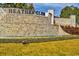 Heather Glen community entrance with a stone water feature and landscaping at 724 Wallace Dr., Little River, SC 29566