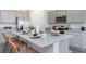 Modern kitchen with gray cabinets, granite countertops, and an island with seating at 724 Wallace Dr., Little River, SC 29566