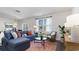 Cozy living room with sectional sofa, coffee table, and large window at 724 Wallace Dr., Little River, SC 29566