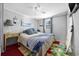 Cozy bedroom with a double bed, nightstand, and surfboard at 817 Wayne St., North Myrtle Beach, SC 29582