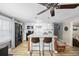 Modern kitchen with white cabinets, a breakfast bar, and wood floors at 817 Wayne St., North Myrtle Beach, SC 29582