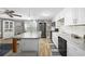 Modern kitchen with white cabinets, stainless steel appliances, and a large island at 817 Wayne St., North Myrtle Beach, SC 29582
