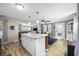 Open floor plan with white kitchen cabinets, island, and dining area at 817 Wayne St., North Myrtle Beach, SC 29582