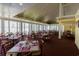 Bright and airy dining room with many tables at 101 Ocean Creek Dr. # Mm-5, Myrtle Beach, SC 29572