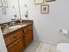 Powder room with granite countertop and wooden vanity at 1044 Martin Ln., Conway, SC 29526