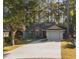 Brick house with attached garage and a landscaped yard at 106 Ashwood Circle, Conway, SC 29526