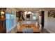 Charming dining area with white chairs and a view into the kitchen at 106 Ivy Creek Ct., Conway, SC 29527