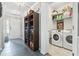 Bright laundry room with washer, dryer, and shelving at 11 Tee Box Trail, Murrells Inlet, SC 29576