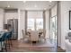 Bright dining area with a charming round table and access to the backyard at 1212 Arizona Dr., Longs, SC 29568